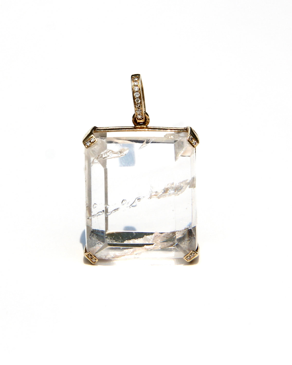 Enhydro quartz extremely clear with 6 water bubbles.  14 k yellow gold with diamonds on each corner.  Enhydro quartz creates a link between Heaven and Earth.