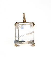 Enhydro quartz extremely clear with 6 water bubbles.  14 k yellow gold with diamonds on each corner.  Enhydro quartz creates a link between Heaven and Earth.