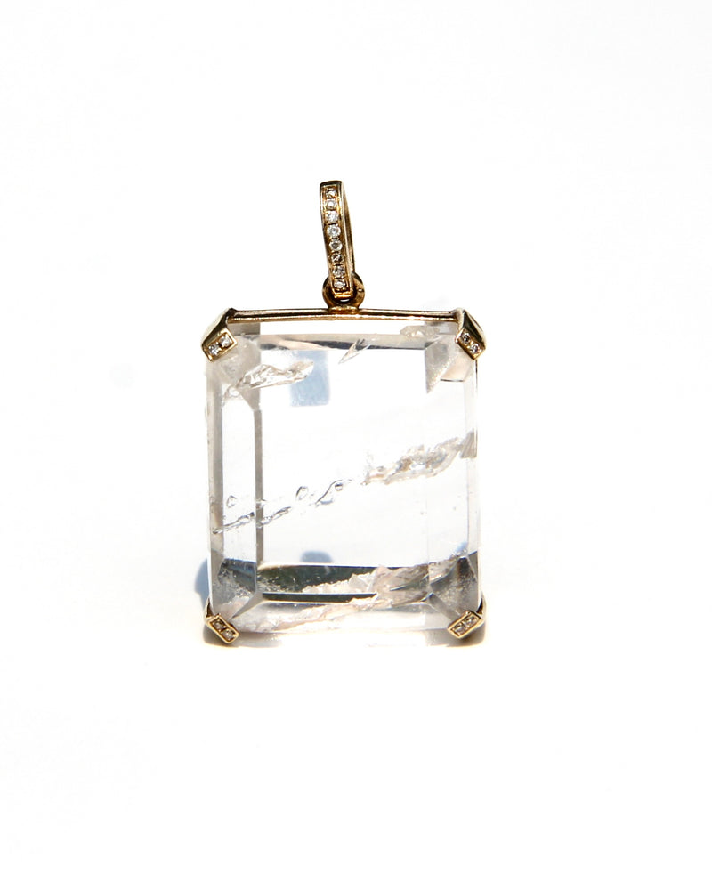 Enhydro quartz extremely clear with 6 water bubbles.  14 k yellow gold with diamonds on each corner.  Enhydro quartz creates a link between Heaven and Earth.