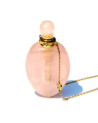 The Vase of Compassion, the vase of Guanyin, overflowing with Love and Compassion for all Humanity.  Carved from crystals resonating with the Heart chakra.  Can be used to stored Elixirs of Light oils or Any diluted essential oils vibrating at the Heart frequency.  The vase of Compassion is slightly shaped like an amphora, and is carved from Rose  quartz with a high frequency.  The chain is long enough (62cm plus 5cms extension) for the vase to rest on the Higher Heart.