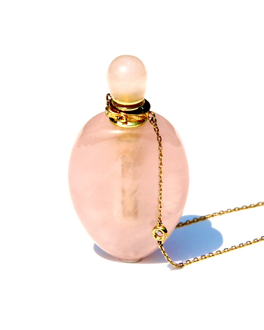 The Vase of Compassion, the vase of Guanyin, overflowing with Love and Compassion for all Humanity.  Carved from crystals resonating with the Heart chakra.  Can be used to stored Elixirs of Light oils or Any diluted essential oils vibrating at the Heart frequency.  The vase of Compassion is slightly shaped like an amphora, and is carved from Rose  quartz with a high frequency.  The chain is long enough (62cm plus 5cms extension) for the vase to rest on the Higher Heart.