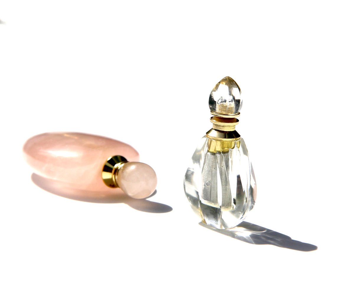 The Vase of Compassion and the Flame of Devotion, sold with one necklace so you can swap them whenever you feel like it. Because the necklace has an extension it can be worn longer so the Vase of Compassion rests on the Higher Heart, and shorter so the Flame of Devotion can be worn a bit higher (I wear mine between the Heart and Throat chakra). I put the Elixirs of Light: Garden of Light ,in the Vase of Compassion and the Garden of Eden,in the Flame of Devotion.  Both are a reminder of my commitment to Be a