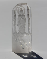 Intaglio carving of the Lord Buddha, with a Lotus on the heart on an Himalayan crystal.  Himalayan crystal are a pure symbol of the Light and many anchor magnificent codes on Gaïa, 