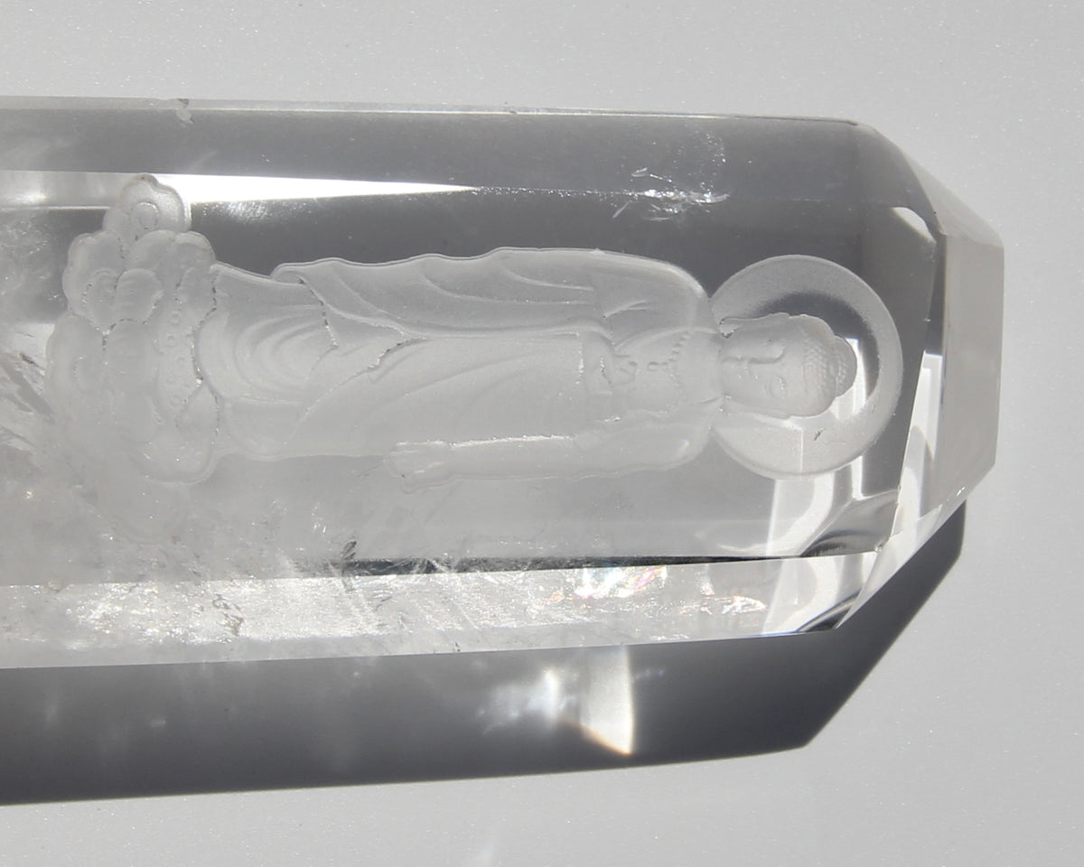 Intaglio carving of the Lord Buddha, with a Lotus on the heart on an Himalayan crystal.  Himalayan crystal are a pure symbol of the Light and many anchor magnificent codes on Gaïa, 