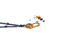 The Jewel in the Lotus necklace, Buddha