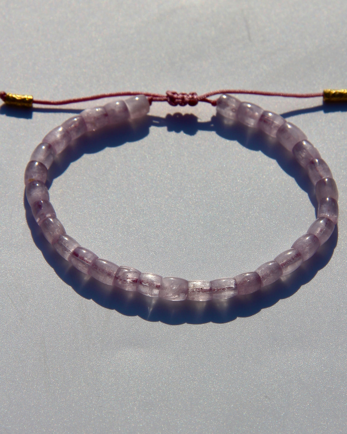 The Healer's bracelet , Kunzite mini.  Small kunzite beads with two 24K gold beads, with circles pattern (symbols of the Core , the center of the Higher Heart) drawn on them.