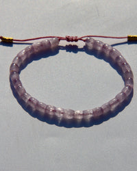The Healer's bracelet , Kunzite mini.  Small kunzite beads with two 24K gold beads, with circles pattern (symbols of the Core , the center of the Higher Heart) drawn on them.