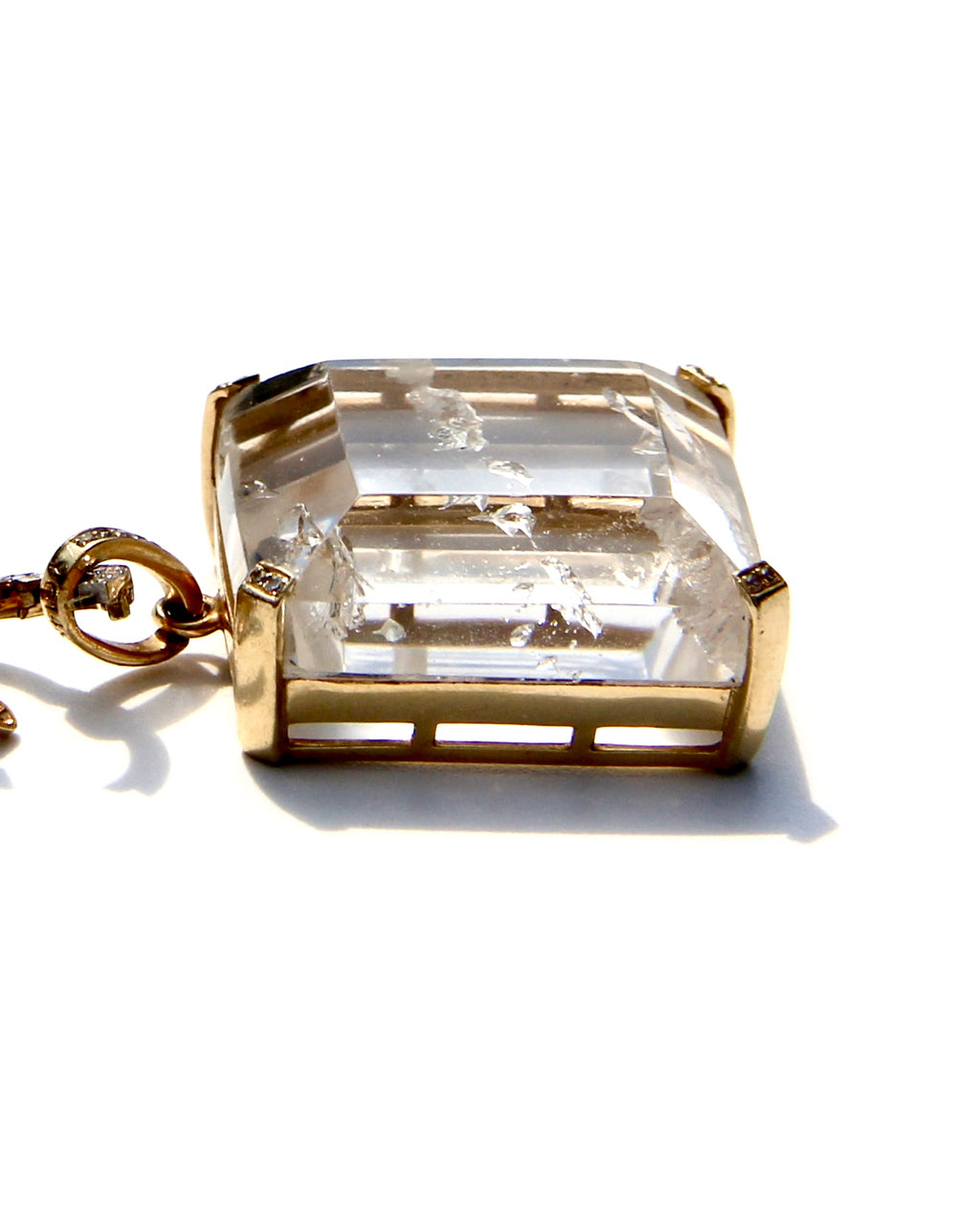 Enhydro quartz extremely clear with 6 water bubbles.  14 k yellow gold with diamonds on each corner.  Enhydro quartz creates a link between Heaven and Earth.
